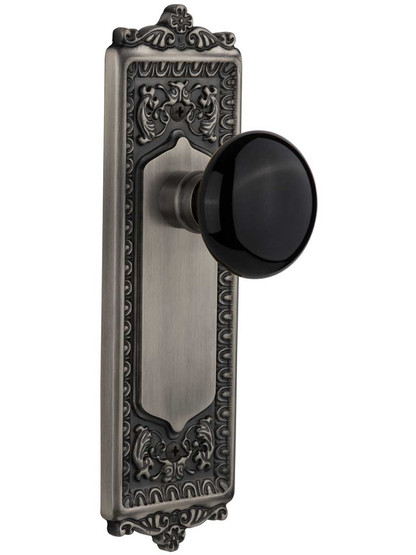 Egg and Dart Style Door Set with Black Porcelain Knobs in Antique Pewter.